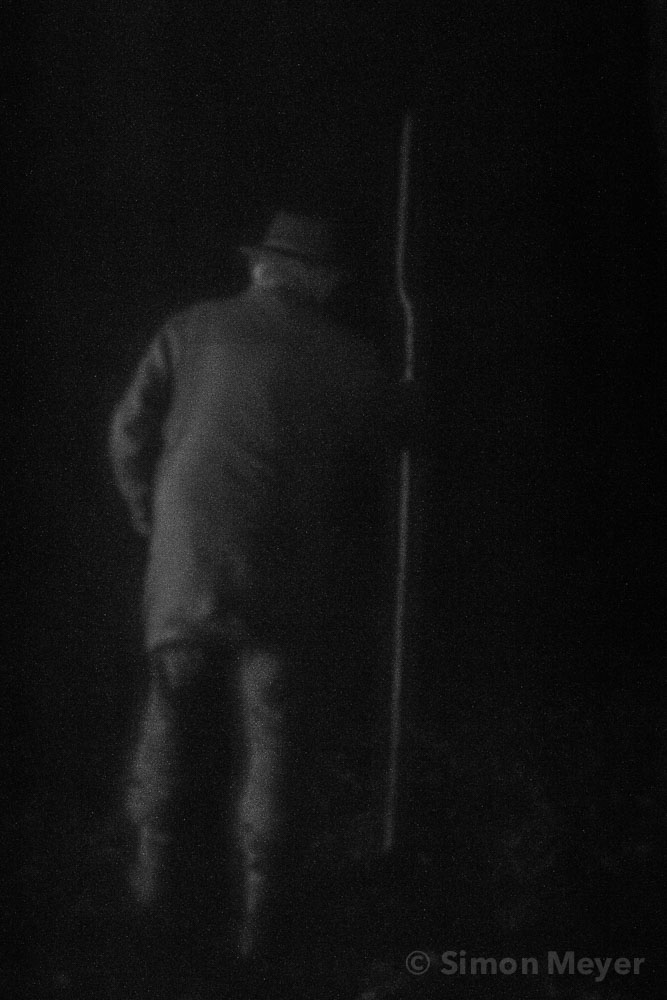 A man walks through the night